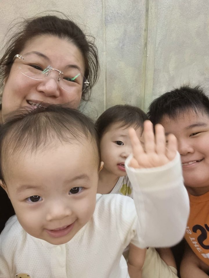 Happy little one in Aunty Jade's care