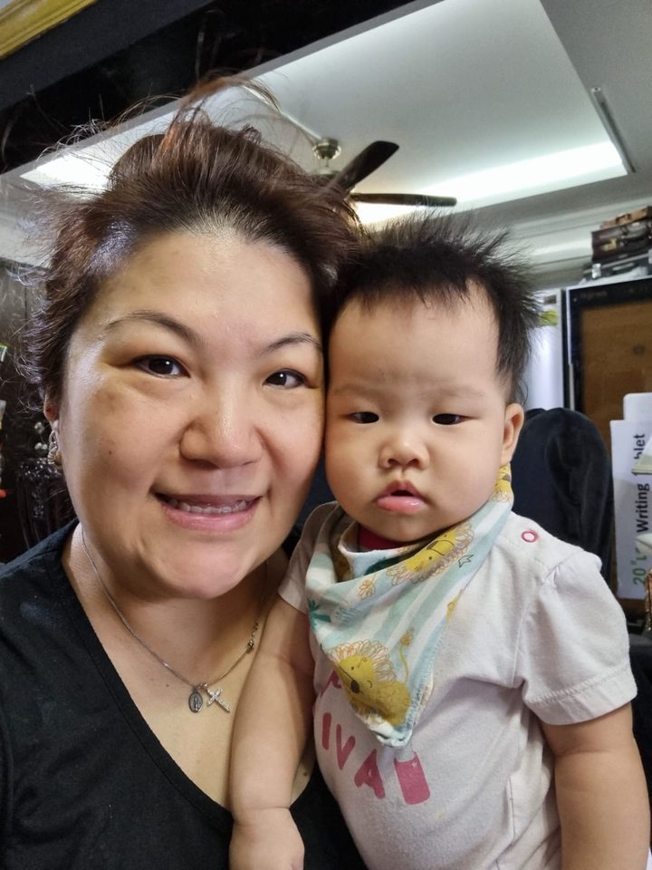 Happy little one in Aunty Jade's care